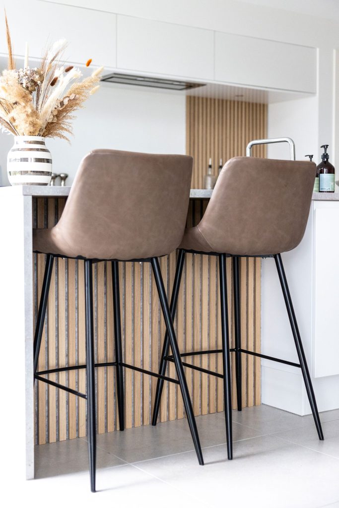 Classic oak, grey felt akupanel used on a kitchen island bar setting